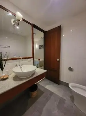 a bathroom with a sink and a toilet and a mirror at Heavenly place in Surin Beach