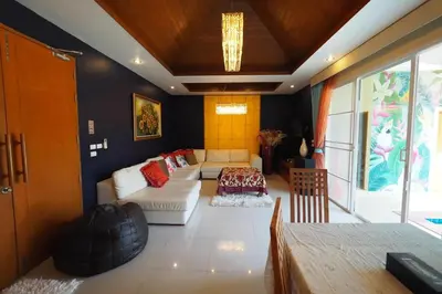 a living room with a couch and a table at 4Bedroom Villa with Private Pool in Ban Klang