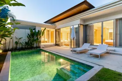 a swimming pool in the backyard of a villa at Trichada Sky 3bed villa, Bangtao, Laguna in Phuket