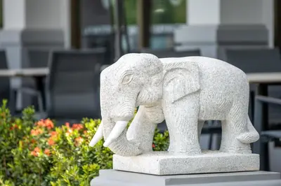 a statue of an elephant standing on a table at AZ Sunrise Resort & Fitness Club in Layan Beach