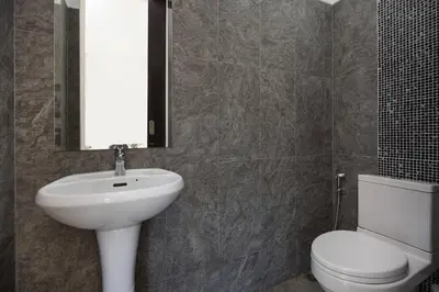 a bathroom with a white sink and a toilet at Relaxing Holidays - 2BR Private Pool Villa Greens 8, Rawai in Rawai Beach