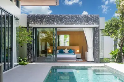 a villa with a bedroom and a pool at Bang Tao Botanica Modern Loft 3 bd in Ban Pak Lak