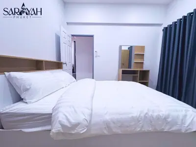 a bedroom with a large bed with white sheets at Sarayah Phuket 4Bed Villa in Ban Tha Rua