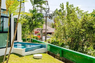 a pool in the backyard of a house with trees at Sunny Stay A8 Charming Residence Close to Nature in Kamala Beach