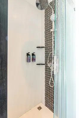 a shower in a bathroom with a glass wall at Sunny Stay A8 Charming Residence Close to Nature in Kamala Beach