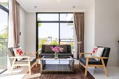 a living room with a couch and two chairs and a table at Sunny Stay A8 Charming Residence Close to Nature in Kamala Beach