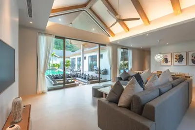 a living room with a couch and a television at V157 Brand New Beautiful Dream Villa in Kamala Beach