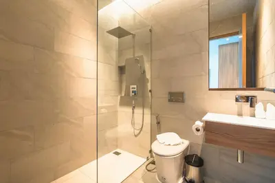 a bathroom with a shower and a toilet and a sink at V157 Brand New Beautiful Dream Villa in Kamala Beach