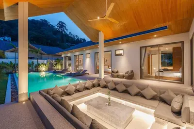 a living room with a couch and a swimming pool at V157 Brand New Beautiful Dream Villa in Kamala Beach