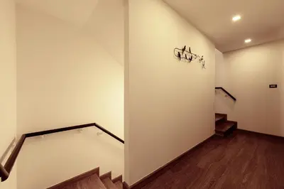 a staircase in a room with stairs and a wall at Spacious 3bd Townhouse in Laguna park in Laguna Phuket