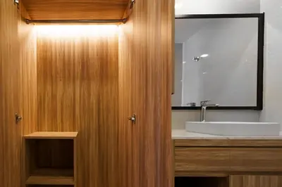 a bathroom with a sink and a large mirror at Lovely studio 5 stars Hotel La Vita in Phuket Town