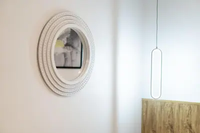 a mirror on a wall in a room at Winks House Patong Phuket 4B in Patong Beach