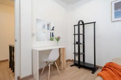 a white room with a desk and a mirror at 4BR villa W Jacuzzi Heart of Patong in Patong Beach