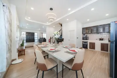 a kitchen and dining room with a table and chairs at 4BR villa W Jacuzzi Heart of Patong in Patong Beach