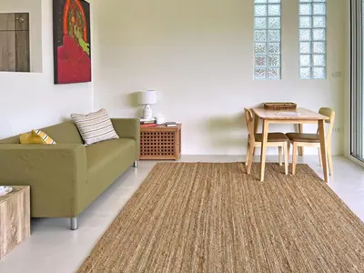 a living room with a couch and a table at At the Beach New 6-9 person Pool Villa Ao Yon Phuket in Ko Thanan