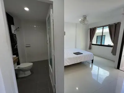 a small bathroom with a bed and a toilet at Patong Easy life 5 in Patong Beach