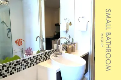 a bathroom with a sink and a mirror at Modern 2-Bedroom Condo in Kamala Near the beach in Kamala Beach
