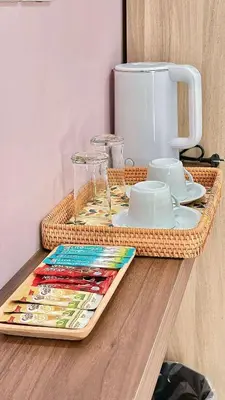 a wicker tray with plates and cups on a counter at The Saii in Ko Yao Yai