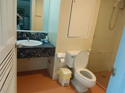 a bathroom with a toilet and a sink at Patong tower mountain view m705 in Patong Beach