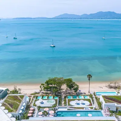an aerial view of the beach and the ocean at Veranda Resort Phuket, Autograph Collection in Panwa Beach