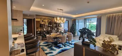 a kitchen and dining room with a christmas tree at Angsana Beachfront Residences in Phuket