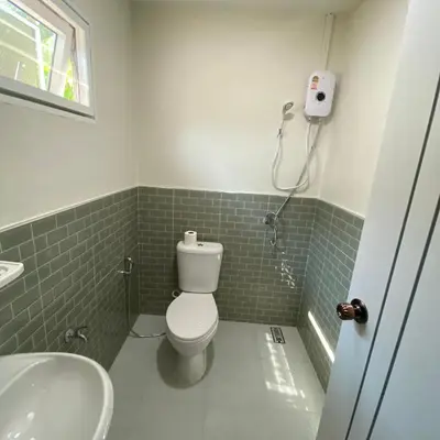 a bathroom with a toilet and a sink at Coral Retreat Koh Yao Yai in Ko Thanan