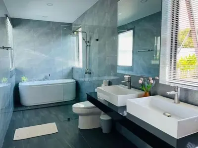 a bathroom with two sinks and a tub and a toilet at V150 5-Star Villa Perfect for Relaxation &Comfort in Rawai Beach