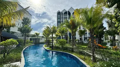a swimming pool in front of a building with palm trees at JU1 NEW Halo Nayang Руб ВАТСАП669З582I976 in Nai Yang Beach