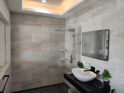 a bathroom with a sink and a mirror and a shower at Sawansa 34B 475m2 Luxury Sea view pool near beach in Patong Beach