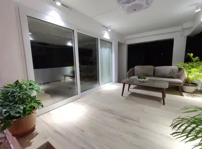a living room with a couch and a table at Sawansa 34B 475m2 Luxury Sea view pool near beach in Patong Beach