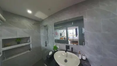 a bathroom with a sink and a mirror at Sawansa 34B 475m2 Luxury Sea view pool near beach in Patong Beach