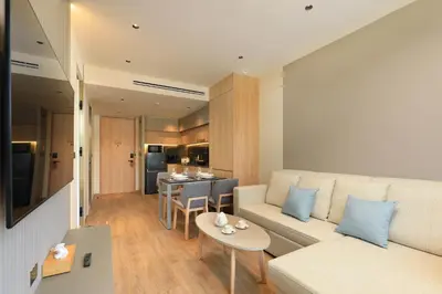 a living room with a couch and a table at New 1bdr apartment BangTao Beach C410 in Laguna Phuket