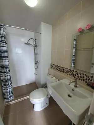 a bathroom with a toilet and a sink at Dcondo Creek Poolview by Lachambre Phuket in Phuket Town