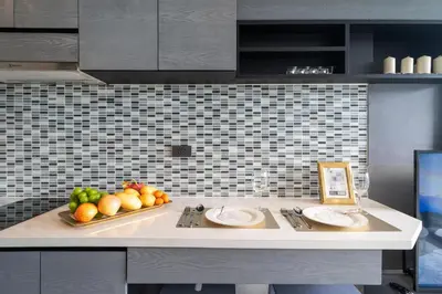 a kitchen counter with two plates and fruit on it at Apartment 1 - bedroom Kamala in Kamala Beach