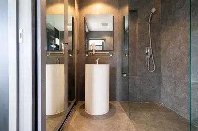 a bathroom with two sinks and a shower at Apartment 1 - bedroom Kamala in Kamala Beach