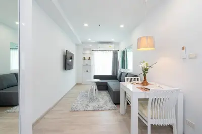 a living room with a table and a couch at Phuket Villa 1 bedroom apartment in Patong in Patong Beach