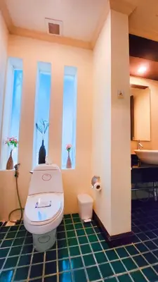 a bathroom with a toilet and a sink at Prima Karon Villa in Karon Beach