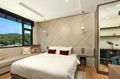 a bedroom with a white bed and a large window at Seaview 1bdr apartment Karon PRO-613 in Karon Beach