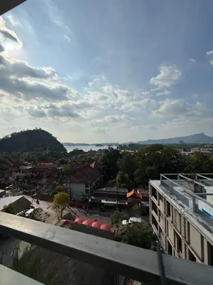 a view of a city from the balcony of a building at The Paradise sea view apartment in Krabi town