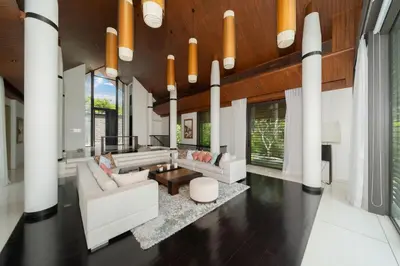 a living room with white furniture and wood ceilings at Exclusive Oceanfront Living, 5BR Pool Villa Elegance in Ko Lek