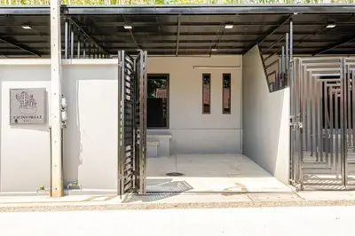 an open door of a building with a gate at Cactus Villa 2024, Krabi in Klong Muang Beach