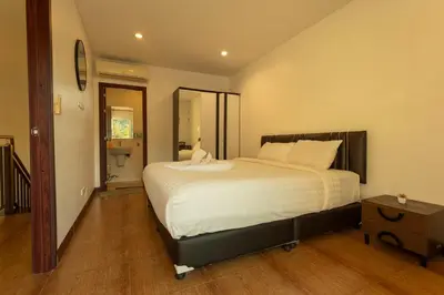 a bedroom with a large white bed in a room at V69 15min Convenient to Patong Building Gym in Kamala Beach