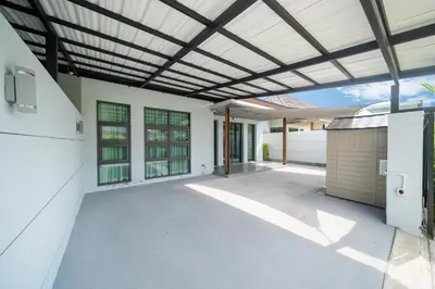 an outdoor patio with awning and a ceiling at Vanille Villa in Balinese style with swimming pool in Ban Saiyuan (1)