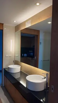 a bathroom with two sinks and a large mirror at Thebirdhouse Patong Phuket203 in Patong Beach