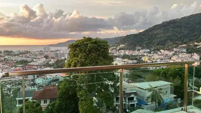 a view of a city from a balcony at Thebirdhouse Patong Phuket303 in Patong Beach