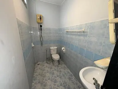 a bathroom with a toilet and a sink at Patong Canal Villa 101 in Patong Beach
