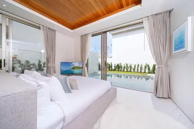 a bedroom with a large bed and a large window at New Build Masterpiece with Private Pool - 4BR Villa in Lux Pride 2 V7 Residence in Bang Tao Beach