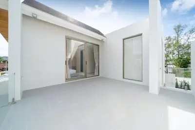 an empty room with white walls and windows at New Elegance & Tropical Luxury - 4BR Pool Villa in Lux Pride 2 V8 Residence, near Laguna in Bang Tao Beach