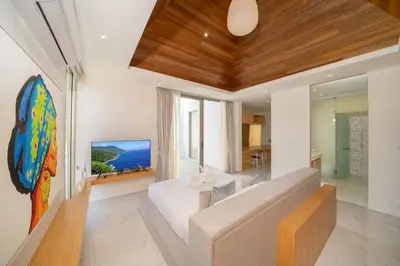 a living room with a couch and a table at Your Private Piece of Paradise! 4BR Pool Villa in the New Lux Pride 2 V9 Residence in Bang Tao Beach