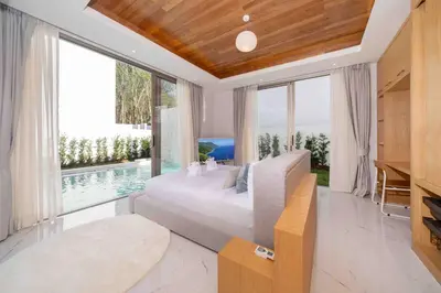 a bedroom with a large bed and a large window at Modern Elegance & Tropical Vibe - 4BR Pool Villa in New Build Residence Lux Pride 2 V10 in Bang Tao Beach